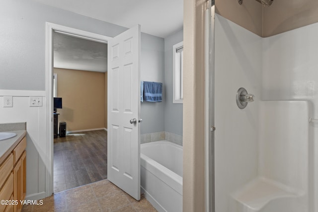 710 Columbus Ave, Moxee, WA 98936 - bathroom with vanity, a stall shower, a bath, and tile patterned floors