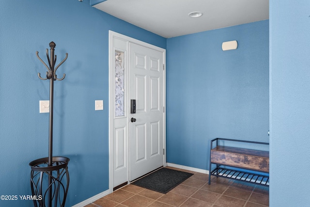 710 Columbus Ave, Moxee, WA 98936 - entrance foyer featuring dark tile patterned flooring and baseboards