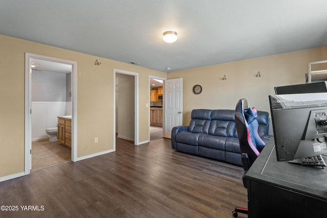 710 Columbus Ave, Moxee, WA 98936 - home office featuring dark wood-type flooring and baseboards
