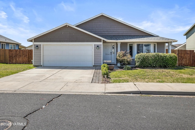710 Columbus Ave, Moxee, WA 98936 - view of front facade featuring an attached garage and driveway