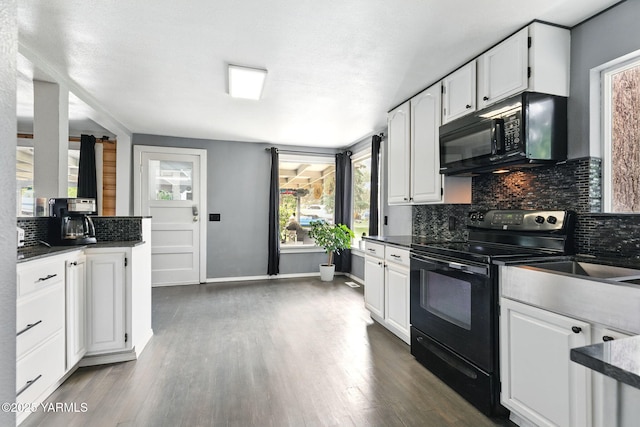 310 Sage Trail Rd, Yakima, WA 98901 - kitchen featuring black appliances, decorative backsplash, white cabinetry, dark countertops, and healthy amount of natural light