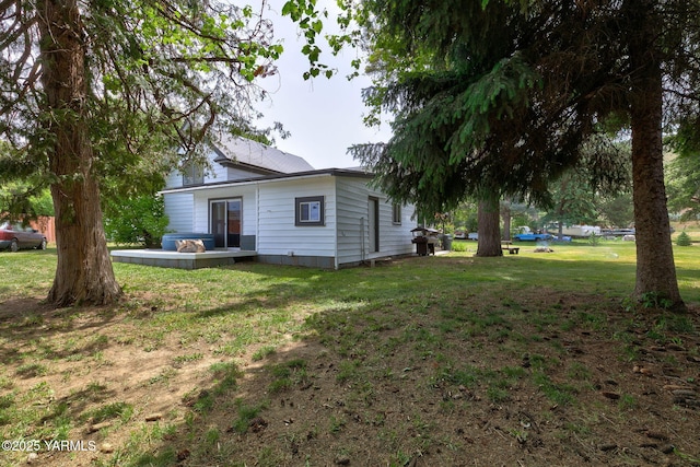 310 Sage Trail Rd, Yakima, WA 98901 - view of home's exterior featuring a deck and a lawn