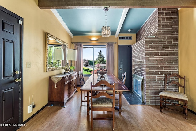 611 Ferncrest Rd, Yakima, WA 98901 - dining space with baseboards, visible vents, wood finished floors, and beamed ceiling