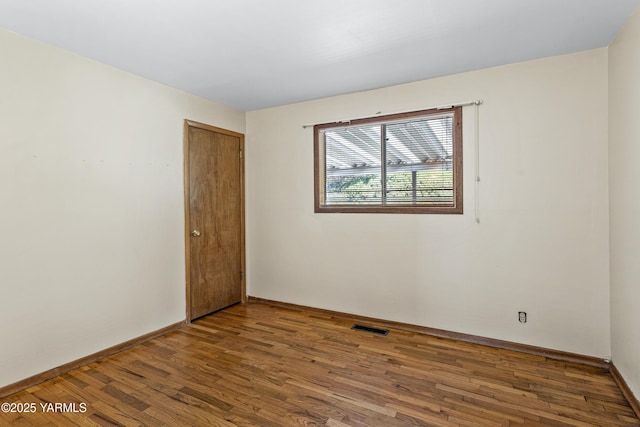 611 Ferncrest Rd, Yakima, WA 98901 - empty room featuring baseboards, wood finished floors, and visible vents