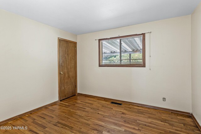 611 Ferncrest Rd, Yakima, WA 98901 - unfurnished room with baseboards and wood finished floors