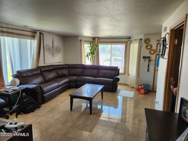 tiled living room with a textured ceiling