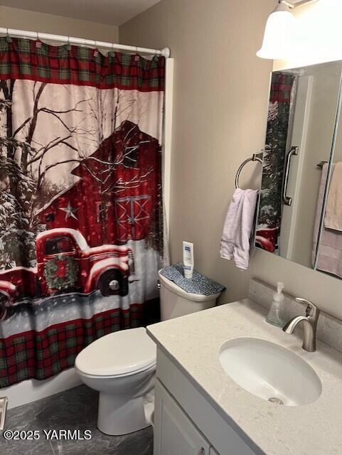 bathroom with vanity and toilet