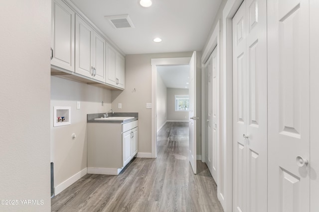 851 E Selah Rd, Yakima, WA 98901 - laundry room with cabinet space, hookup for a washing machine, baseboards, light wood-style flooring, and recessed lighting