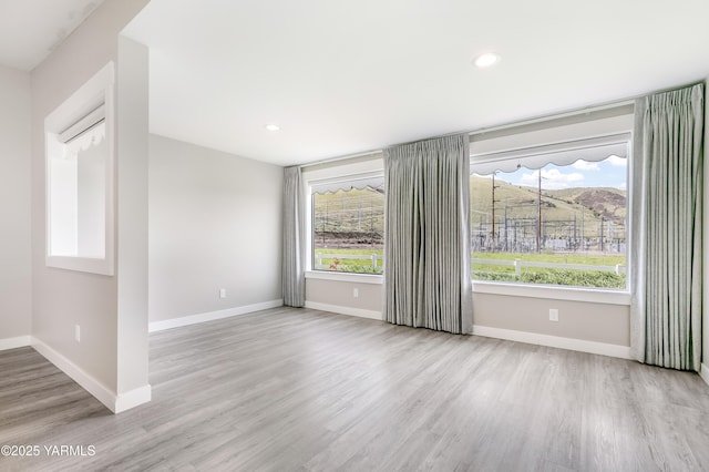 851 E Selah Rd, Yakima, WA 98901 - empty room featuring wood finished floors, baseboards, and recessed lighting