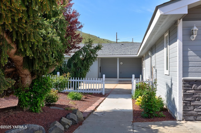 851 E Selah Rd, Yakima, WA 98901 - property entrance with fence, stone siding, and covered porch