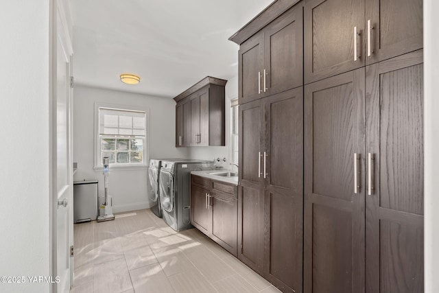 5 N 80th Ave, Yakima, WA 98908 - washroom featuring a sink, independent washer and dryer, baseboards, and cabinet space