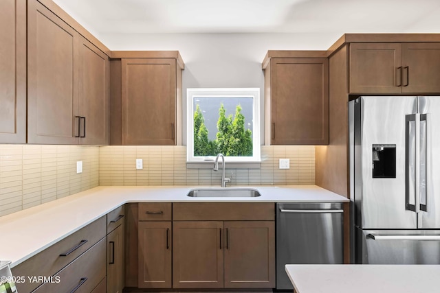 4303 Tayhill Way, Yakima, WA 98908 - kitchen with stainless steel appliances, a sink, decorative backsplash, and light countertops