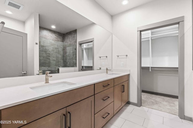 4303 Tayhill Way, Yakima, WA 98908 - bathroom featuring a stall shower, double vanity, recessed lighting, tile patterned flooring, and baseboards