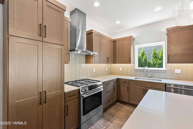 4303 Tayhill Way, Yakima, WA 98908 - kitchen featuring stainless steel appliances, a sink, wall chimney range hood, light countertops, and recessed lighting