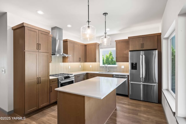 4303 Tayhill Way, Yakima, WA 98908 - kitchen featuring appliances with stainless steel finishes, wall chimney range hood, a sink, backsplash, and recessed lighting