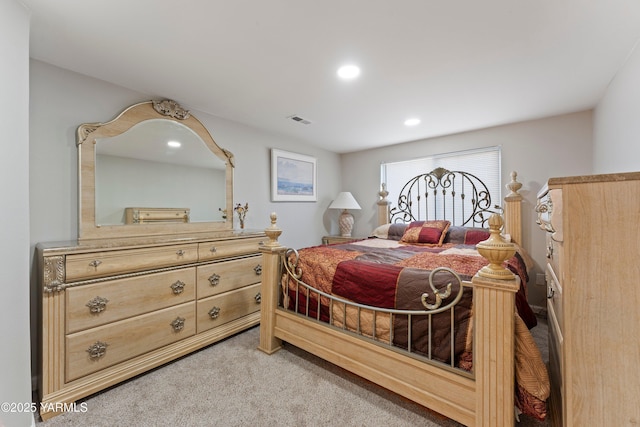 bedroom featuring light carpet, visible vents, and recessed lighting