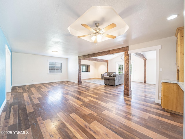 230 Krough Rd, Prosser, WA 99350 - unfurnished living room featuring baseboards, ceiling fan, and hardwood / wood-style floors