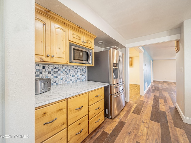 230 Krough Rd, Prosser, WA 99350 - kitchen featuring decorative backsplash, appliances with stainless steel finishes, light brown cabinetry, light countertops, and dark wood-type flooring