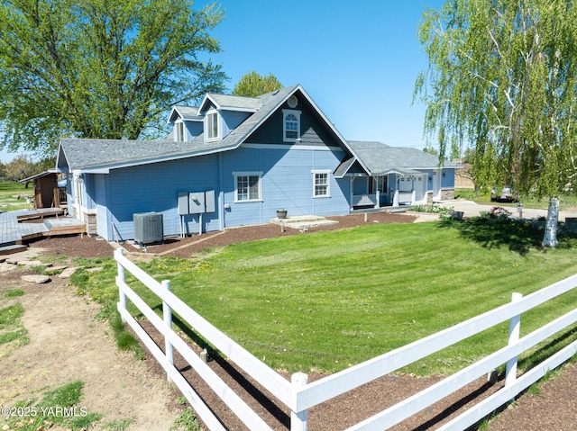 230 Krough Rd, Prosser, WA 99350 - view of front facade with a deck, central AC, fence, and a front lawn