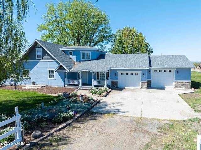 230 Krough Rd, Prosser, WA 99350 - view of front of property featuring an attached garage, concrete driveway, a porch, and a front yard