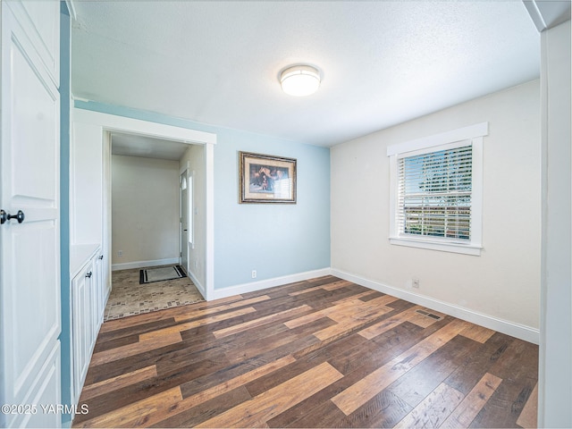 230 Krough Rd, Prosser, WA 99350 - spare room with wood-type flooring, baseboards, and visible vents