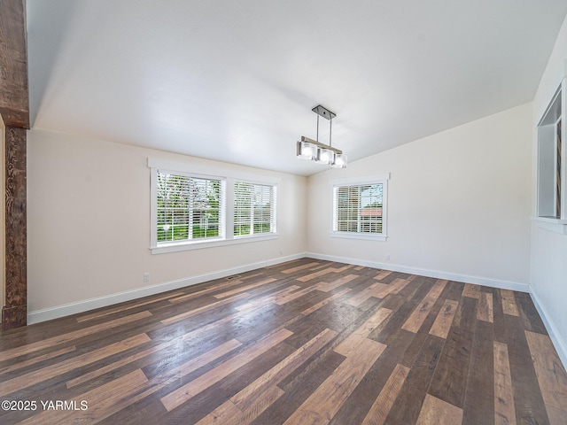 230 Krough Rd, Prosser, WA 99350 - unfurnished dining area with baseboards, vaulted ceiling, and dark wood-type flooring