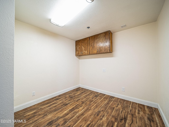 230 Krough Rd, Prosser, WA 99350 - spare room featuring baseboards and dark wood finished floors