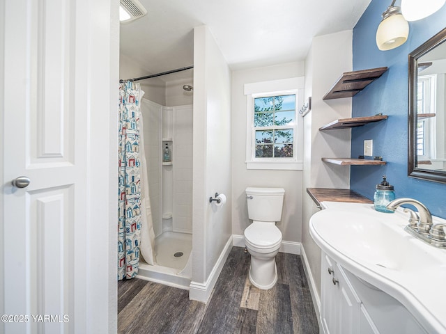 230 Krough Rd, Prosser, WA 99350 - full bathroom with baseboards, a stall shower, wood finished floors, and visible vents