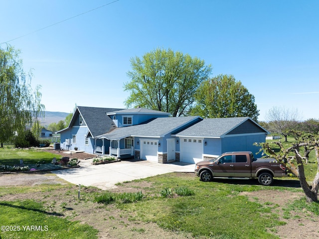 230 Krough Rd, Prosser, WA 99350 - view of front facade featuring driveway, a front yard, roof with shingles, an attached garage, and stone siding