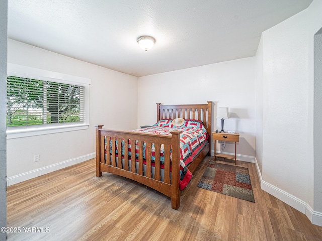 230 Krough Rd, Prosser, WA 99350 - bedroom with baseboards and wood finished floors