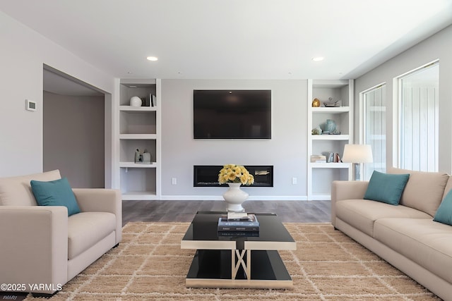 3 Burning Tree Dr Unit 3, Yakima, WA 98902 - living room with built in shelves, a glass covered fireplace, wood finished floors, and recessed lighting