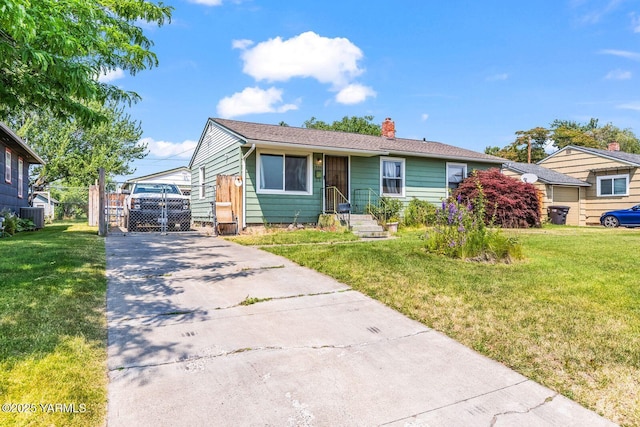 1306 S 6th Ave, Yakima, WA 98902 - view of front facade featuring a chimney and concrete driveway