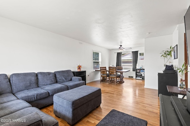 1306 S 6th Ave, Yakima, WA 98902 - living room with a ceiling fan and light wood-style floors