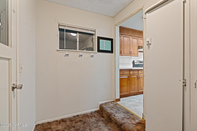 4905 Glenside Ct, Yakima, WA 98908 - hall featuring carpet flooring, a textured ceiling, and baseboards