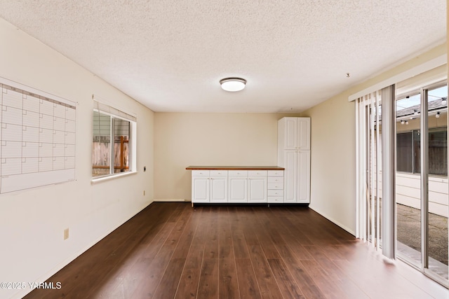 4905 Glenside Ct, Yakima, WA 98908 - spare room with dark wood-style floors, a textured ceiling, and baseboards