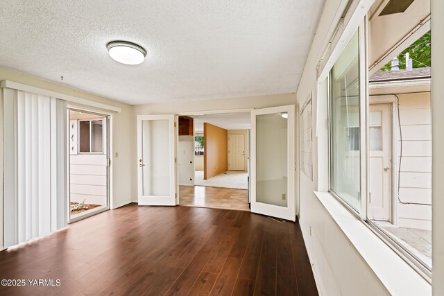 4905 Glenside Ct, Yakima, WA 98908 - empty room with a textured ceiling, wood finished floors, and baseboards
