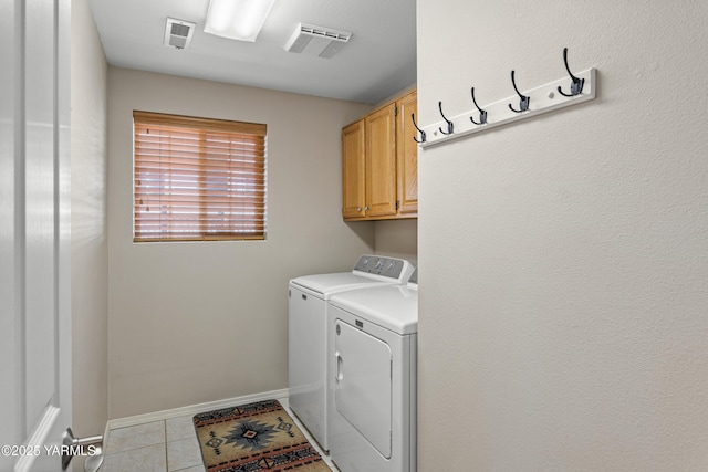 12 N 93rd Ave, Yakima, WA 98908 - clothes washing area with visible vents, tile patterned flooring, cabinet space, and washer and clothes dryer