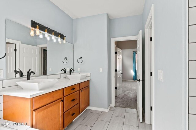 815 Trout Lake Ct, Yakima, WA 98901 - bathroom with double vanity and baseboards