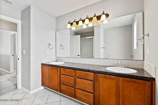 815 Trout Lake Ct, Yakima, WA 98901 - full bath with double vanity, a shower stall, and tile patterned flooring