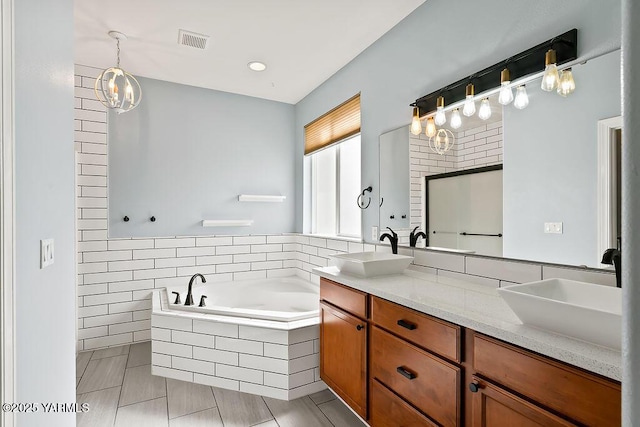 815 Trout Lake Ct, Yakima, WA 98901 - bathroom with double vanity, a bath, tile patterned flooring, and a chandelier