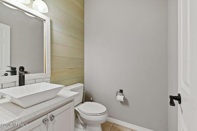 815 Trout Lake Ct, Yakima, WA 98901 - half bath with wood walls, vanity, and tile patterned flooring