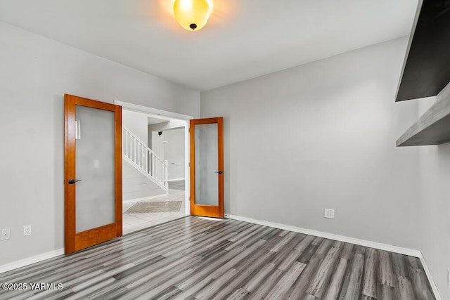 815 Trout Lake Ct, Yakima, WA 98901 - unfurnished room featuring wood finished floors, stairs, and french doors