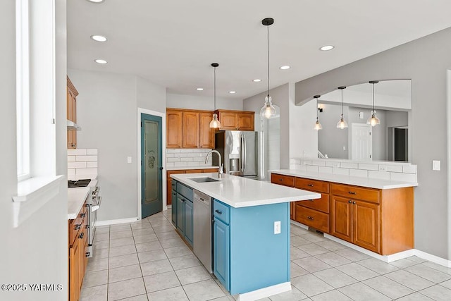 815 Trout Lake Ct, Yakima, WA 98901 - kitchen with stainless steel appliances, backsplash, light countertops, light tile patterned floors, and recessed lighting