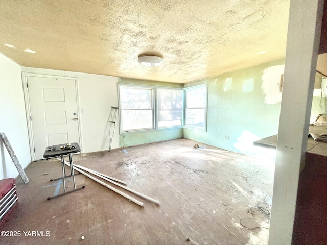 interior space with a textured ceiling