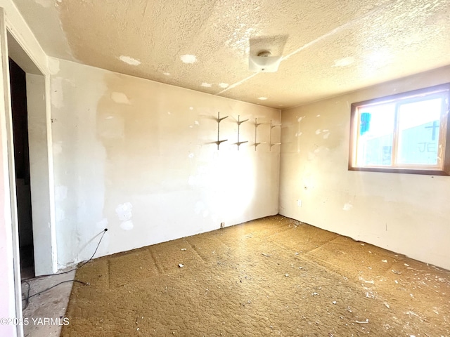 empty room with a textured ceiling