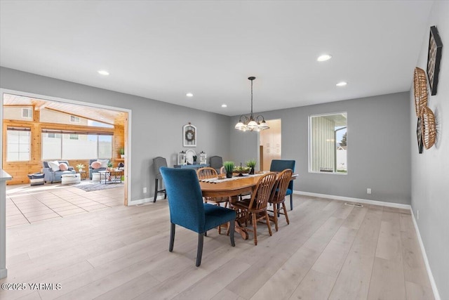 dining room featuring baseboards, a notable chandelier, light wood-type flooring, and recessed lighting