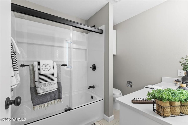 full bathroom featuring shower / bath combination with glass door, tile patterned flooring, toilet, and vanity