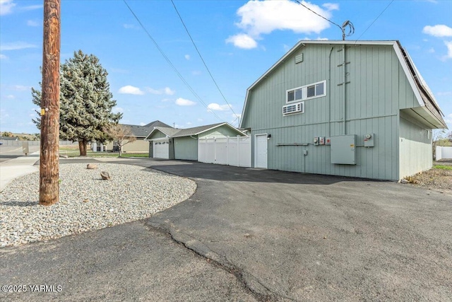 exterior space featuring fence and driveway
