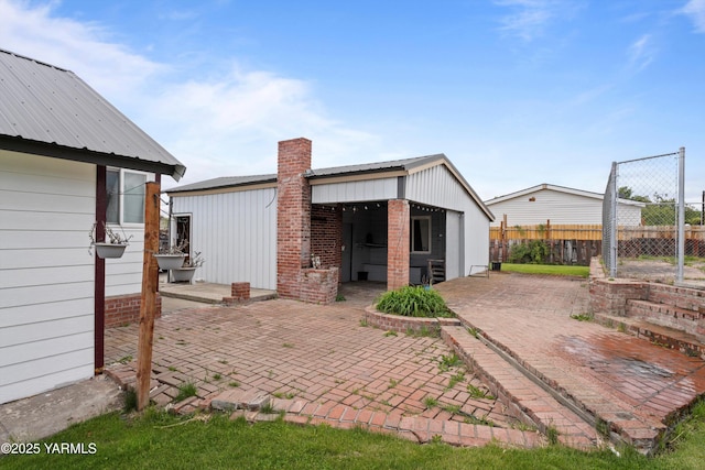 1000 Franklin Rd, Tieton, WA 98947 - back of house with fence, a patio, and a chimney