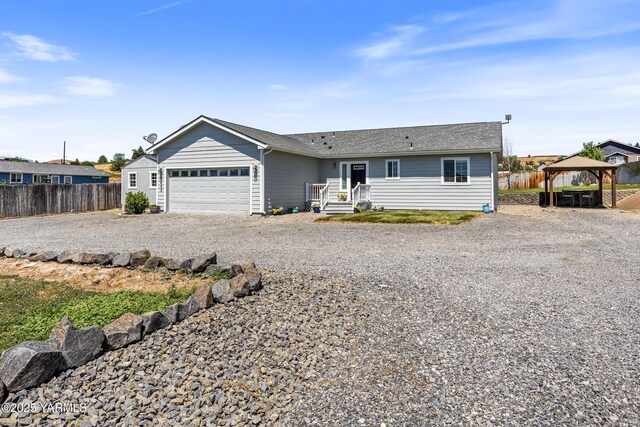 3485 Selah Loop Rd, Selah, WA 98942 - ranch-style home with a gazebo, driveway, an attached garage, and a shingled roof